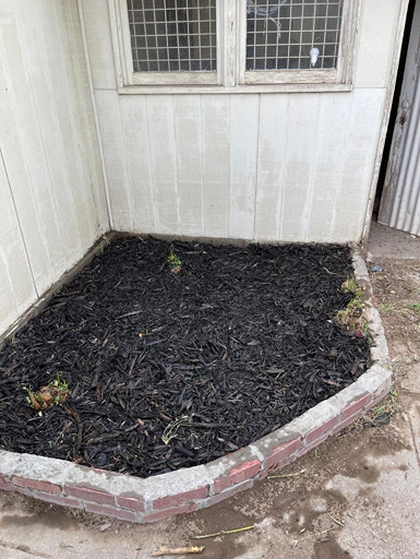 freshly installed black mulch around garden beds, showcasing the results of professional mulch landscaping and mulch installation by Pacific Clean Pro Wash in Yakima